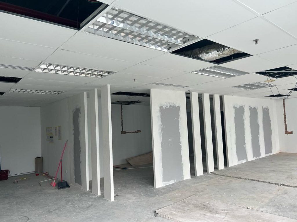 Installed drywall partitions with joint compound applied.