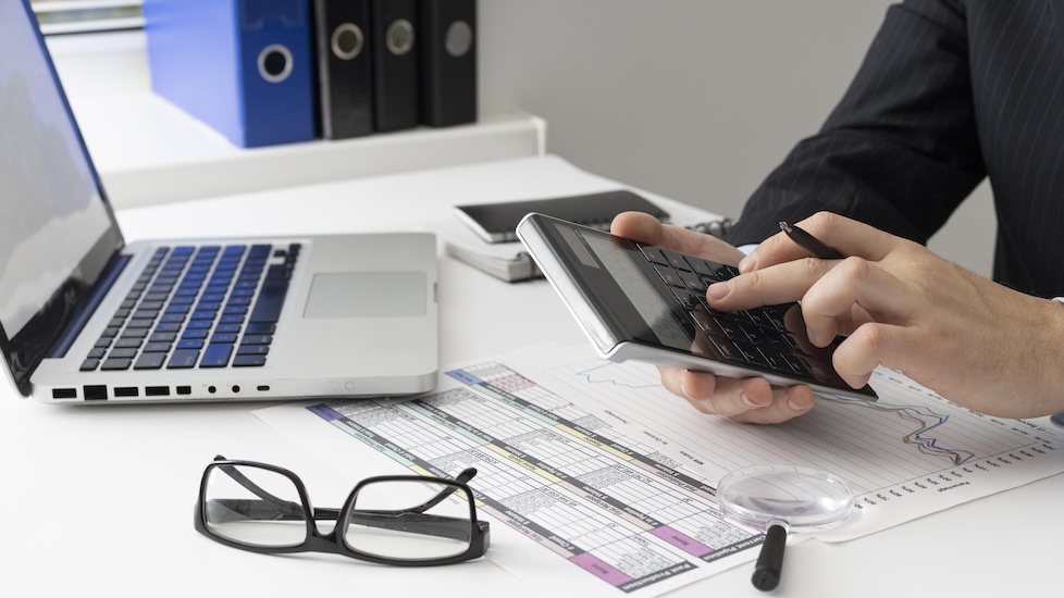 businessman calculating office renovation budget