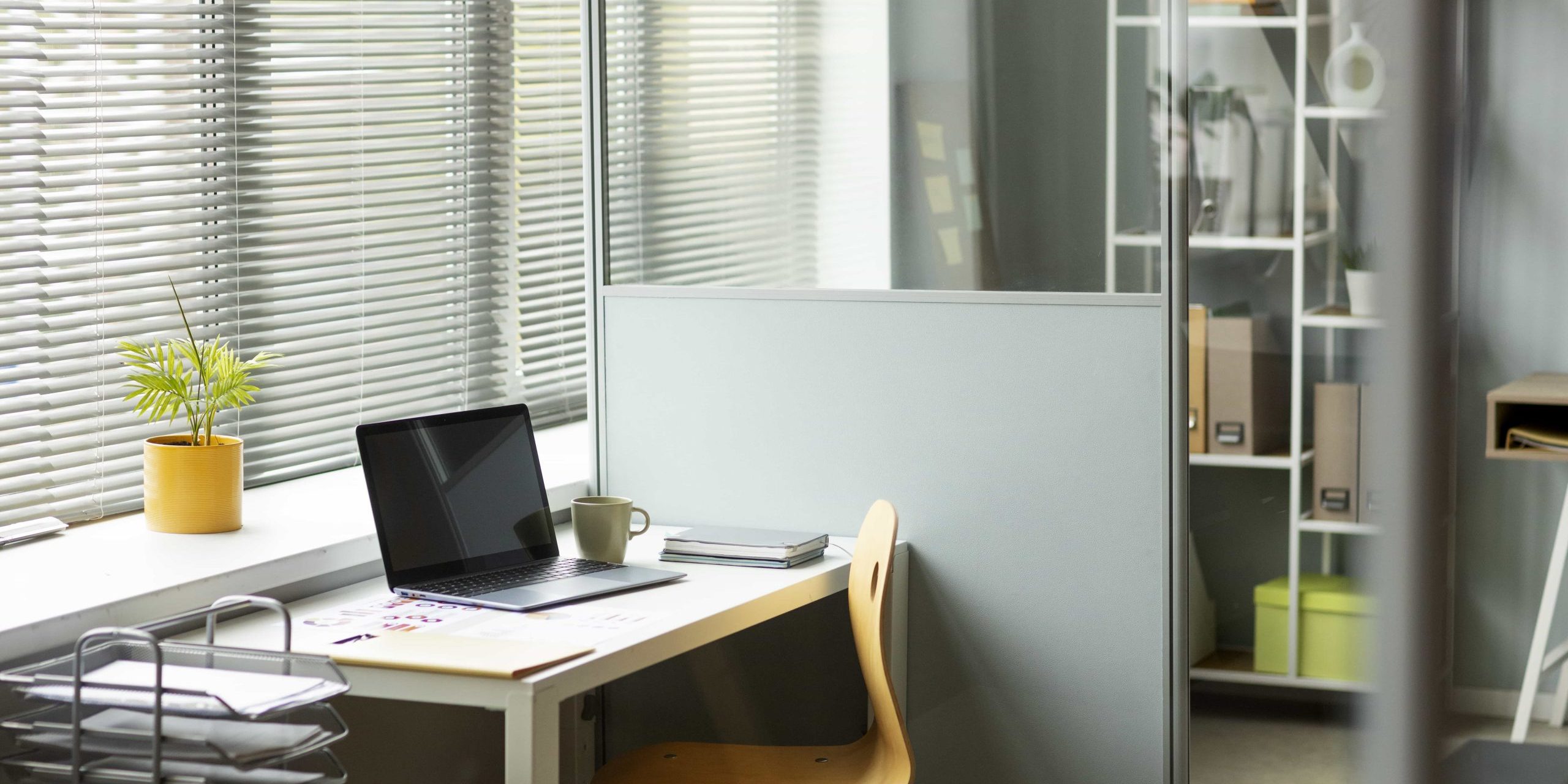 Workspace with partition walls and a simple desk setup