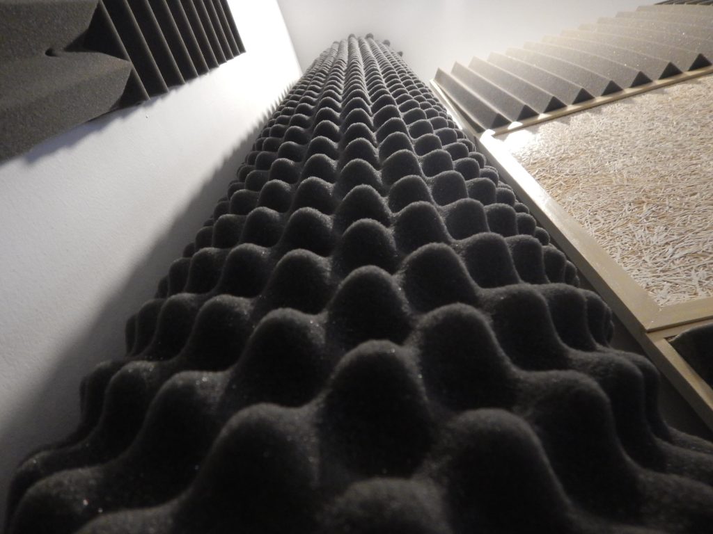 Close-up of acoustic foam panels designed to absorb sound and reduce echo in a room