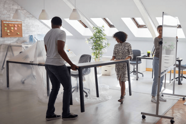 Team collaborating during office renovation and workspace improvement