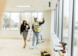 Construction supervisor discussing renovation timeline with office manager