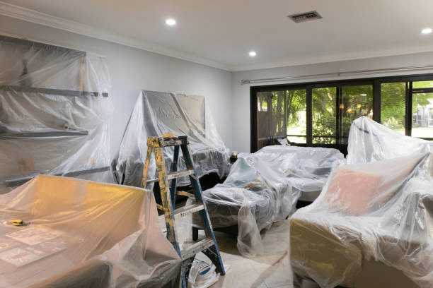 living-room-covered-with-plastic-for-painting room covered with plastic during renovation