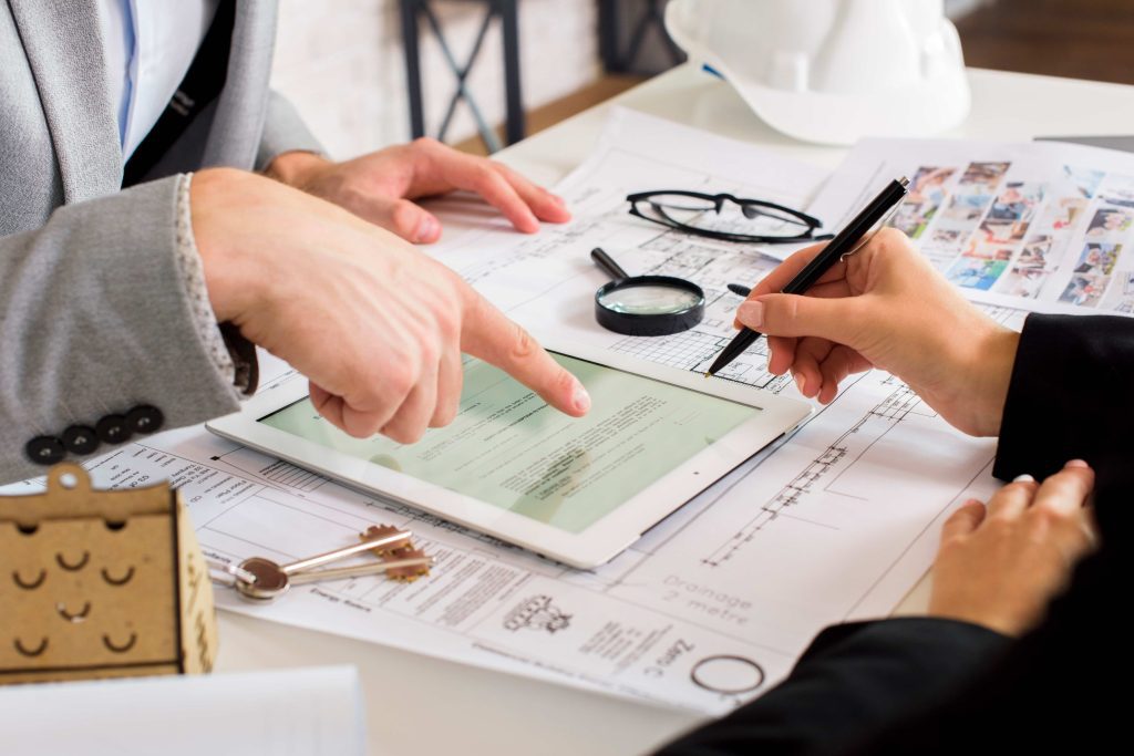 Careful review of contract terms to prevent quiet cost escalation in office renovation projects.